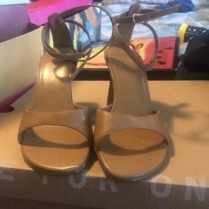 Beige woman’s heels.